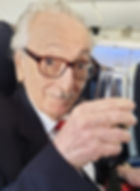 Ivan Moscovich toasting his glass July 2
